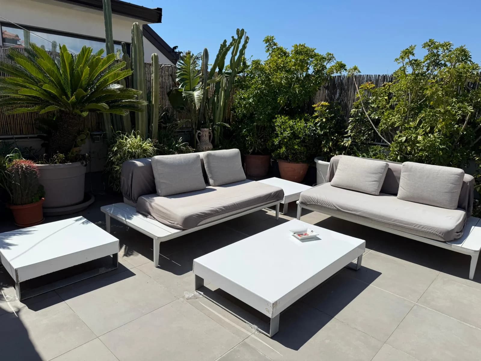 Sunlit private terrace at the Etna Royal Penthouse in Sicily.